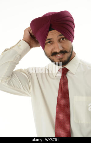 Businessman scratching his head and looking confused Stock Photo