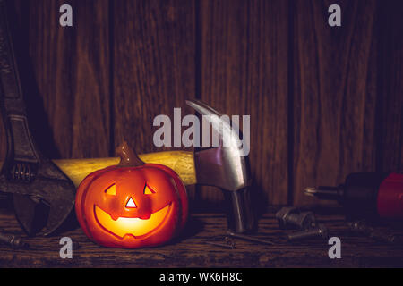 Happy Halloween day with construction tools and home DIY handy tools on rusty wooden background concept with copy space. Stock Photo