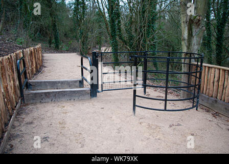 Modern metal stile protecting footpath from motorcycles Stock Photo