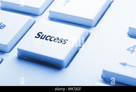 success in business concept with key on computer keyboard Stock Photo