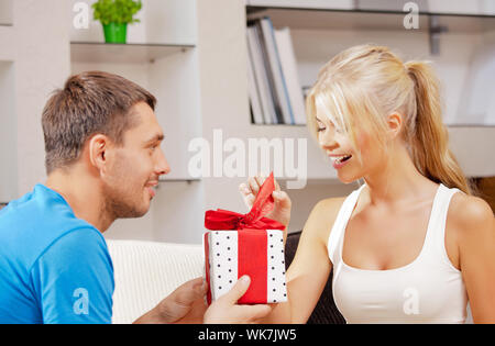 happy romantic couple with gift Stock Photo