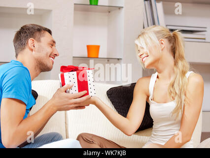 happy romantic couple with gift Stock Photo
