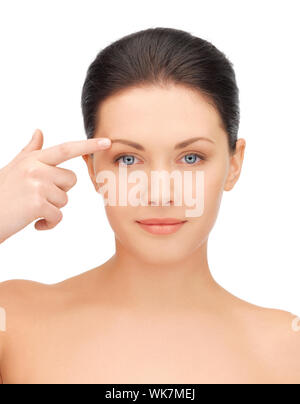 picture of beautiful woman pointing to forehead Stock Photo