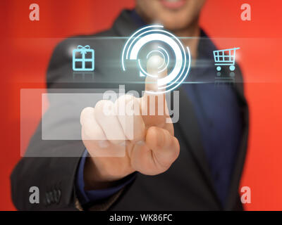 handsome man in suit pressing virtual button Stock Photo