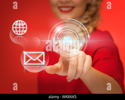 picture of lovely woman in red dress pressing virtual button Stock Photo