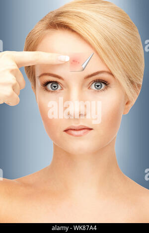 picture of beautiful woman pointing to forehead Stock Photo