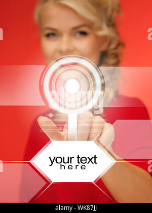 picture of lovely woman in red dress pressing virtual button Stock Photo