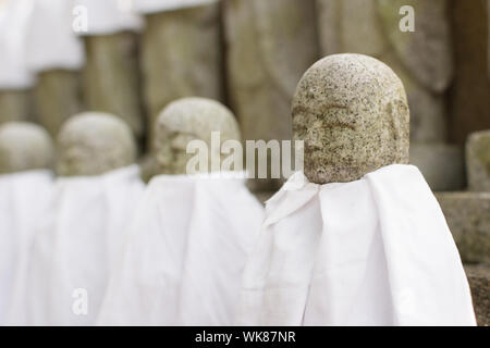 Japanese stone statue Ksitigarbha Bodhisattva in garden. Stock Photo