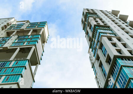 Low angle view of Modern skyscrapers Buildings in Kolkata City. Sunlight reflection, blue sky and white Fluffy clouds during sunset. Directly below vi Stock Photo
