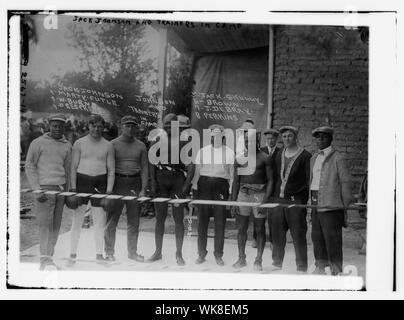 Jack Johnson & trainer in camp- Marty Cutle, W. Burns, C. Respress, Jack Skully, J. DeBray, Perkins Stock Photo