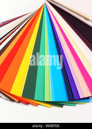 Colored samples of different papers on white background, business cards Stock Photo