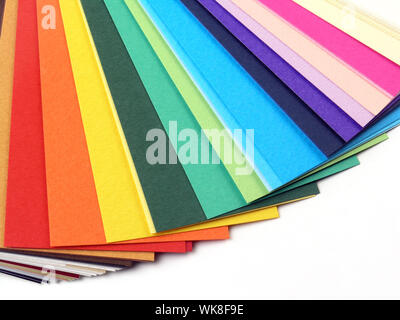 Colored samples of different papers on white background, business cards Stock Photo