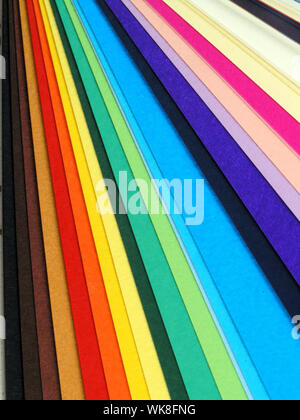 Colored samples of different papers on white background, business cards Stock Photo