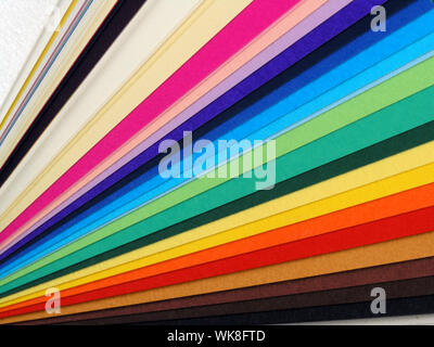 Colored samples of different papers on white background, business cards Stock Photo