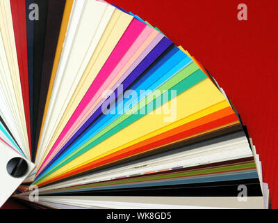 Colored samples of different papers on white background, business cards Stock Photo