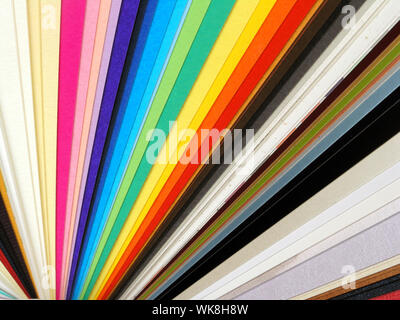 Colored samples of different papers on white background, business cards Stock Photo