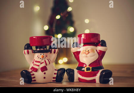 Christmas decoration with a mini Christmas tree on a blurred background. Bokeh Stock Photo