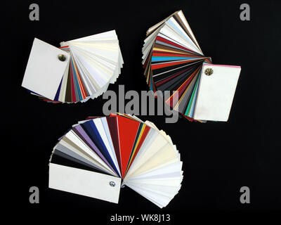 Colored samples of different papers on black background Stock Photo