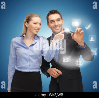man and woman working with virtual screen Stock Photo