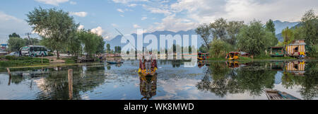 A couple of boys fishing in Dal Lake, Srinagar on a late afternoon. Stock Photo