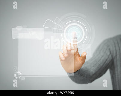 man pressing virtual button Stock Photo