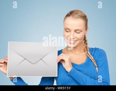 picture of smiling woman showing virtual envelope Stock Photo