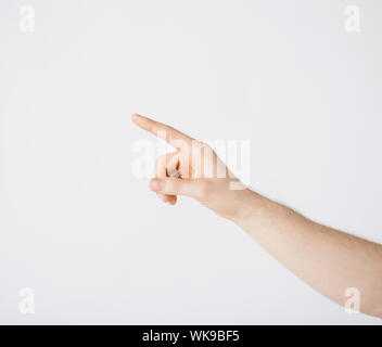 man hand pointing at something Stock Photo
