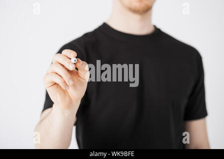 close up of man writing something in the air Stock Photo