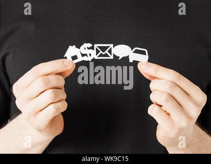 close up of man hands showing paper symbols Stock Photo