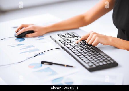 woman hands typing on keyboard Stock Photo