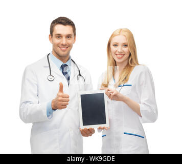 two young doctors holding tablet pc in hands Stock Photo