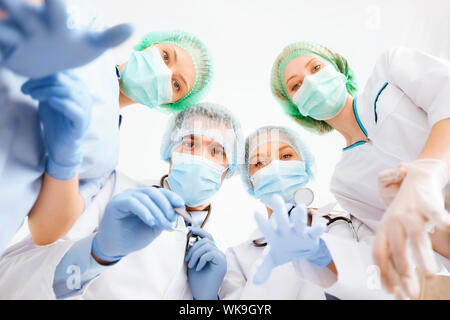 group of doctors in operating room Stock Photo
