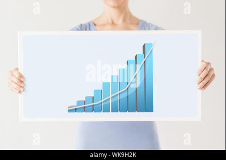 woman holding board with 3d graph Stock Photo