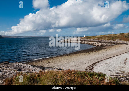 The beach and lighthouse beside Loch Broom Rhue nr Ullapool Ross & Cromarty, Highland Scotland Stock Photo