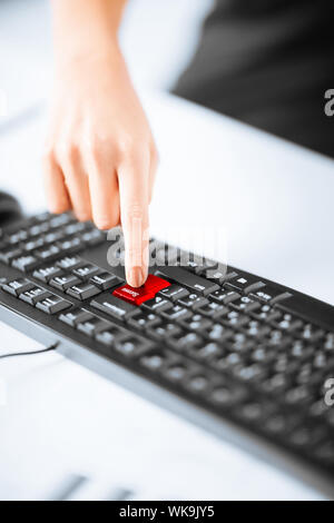 picture of hand pressing success button on keyboard Stock Photo