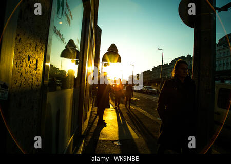 Beautiful dusky and colourful sunlight captured at a bus stop during sunset in the street, Vienna 2018 Stock Photo