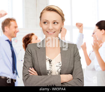 business and success - happy businesswoman celebrating succes in office Stock Photo