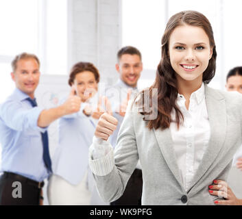 successful business team showing thumbs up Stock Photo - Alamy
