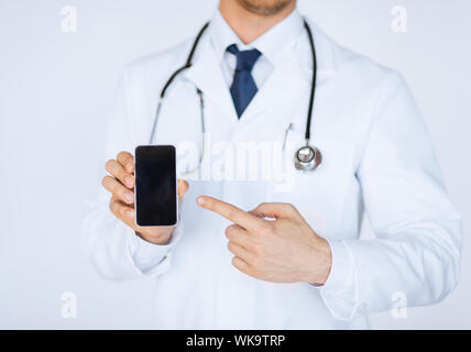 doctor pointing at smartphone Stock Photo