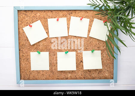 seven stickers or letterheads on a corkboard, a notification concept, copy space, a planning or reminder concept Stock Photo