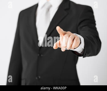 man hand pointing at something Stock Photo