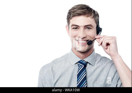 Smiling young call center executive Stock Photo