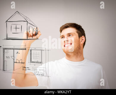 man drawing blueprint on virtual screen Stock Photo