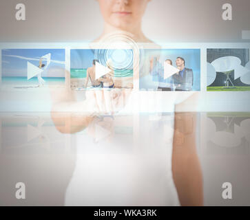 woman pressing button on virtual screen Stock Photo