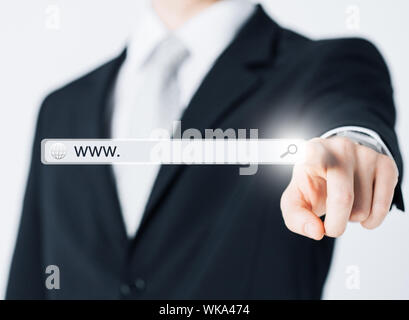 technology, searching system and internet concept - businessman pressing Search button Stock Photo