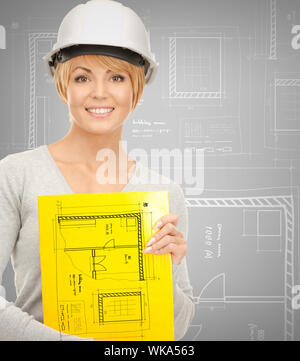 building, developing, consrtuction, architecture concept - female contractor in helmet Stock Photo