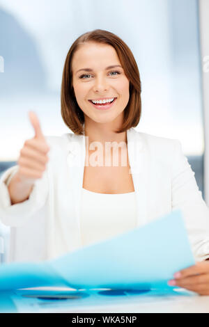 businesswoman showing thumbs up Stock Photo