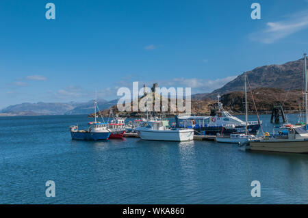 Castle Moil Kyleakin Isle of Skye with fishing boats in harbour Scotland Stock Photo