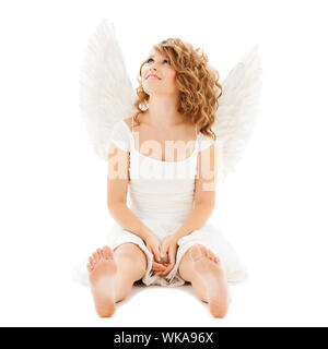 holidays and costumes concept - happy teenage angel girl Stock Photo