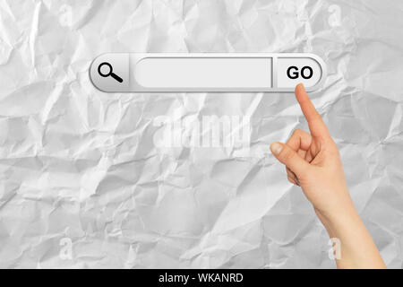 Human hand indicates the search bar in browser. White background Stock Photo